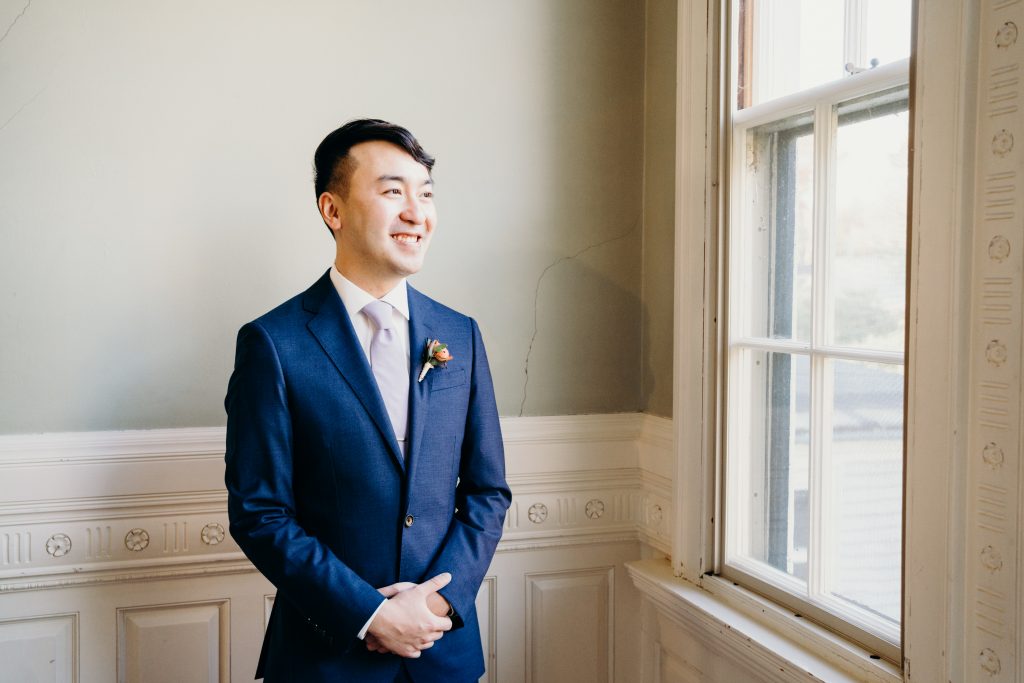 groom portrait on the staircase of the Lyman Estate wedding venue in Waltham MA