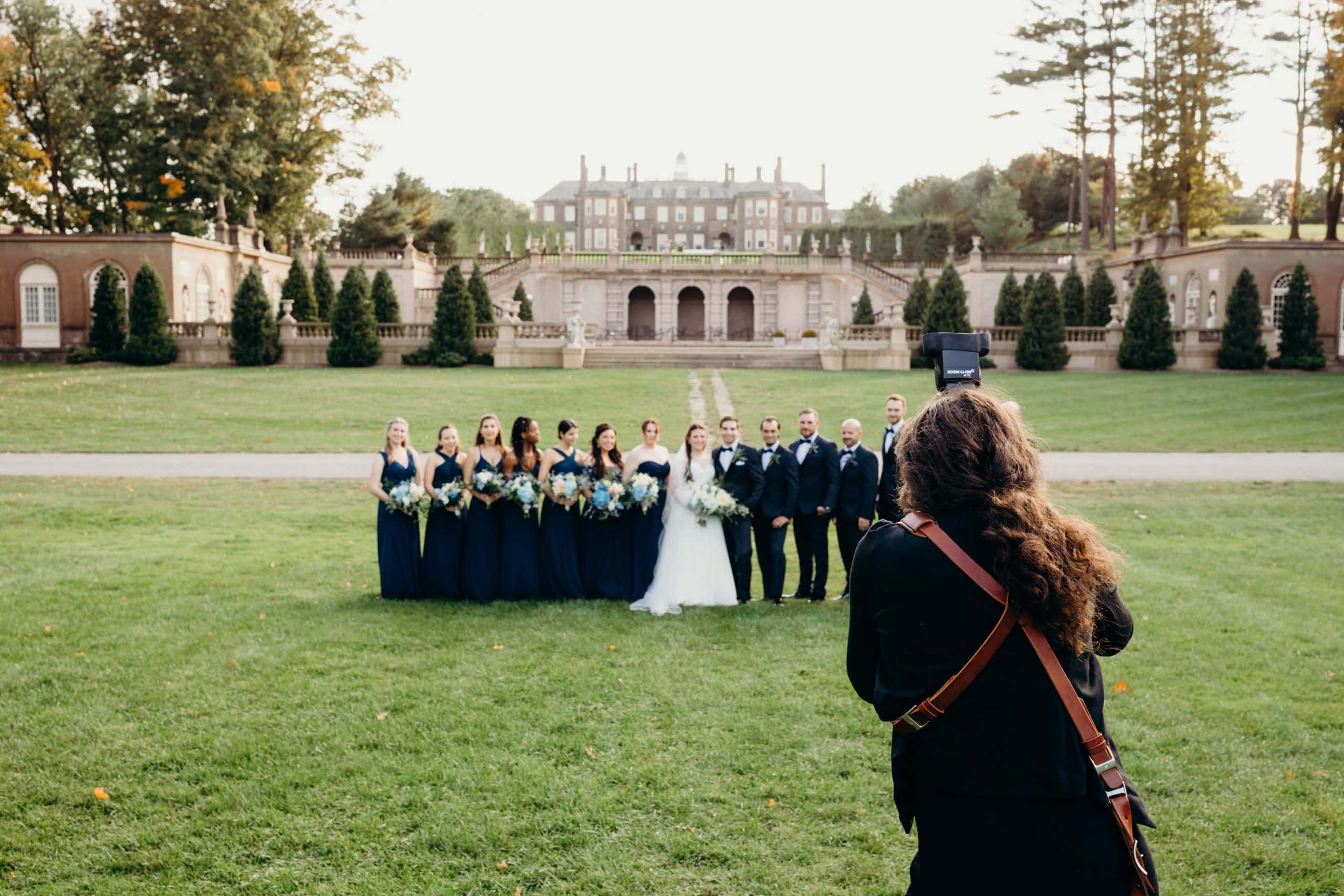 photo of boston wedding photographer photographing a wedding party