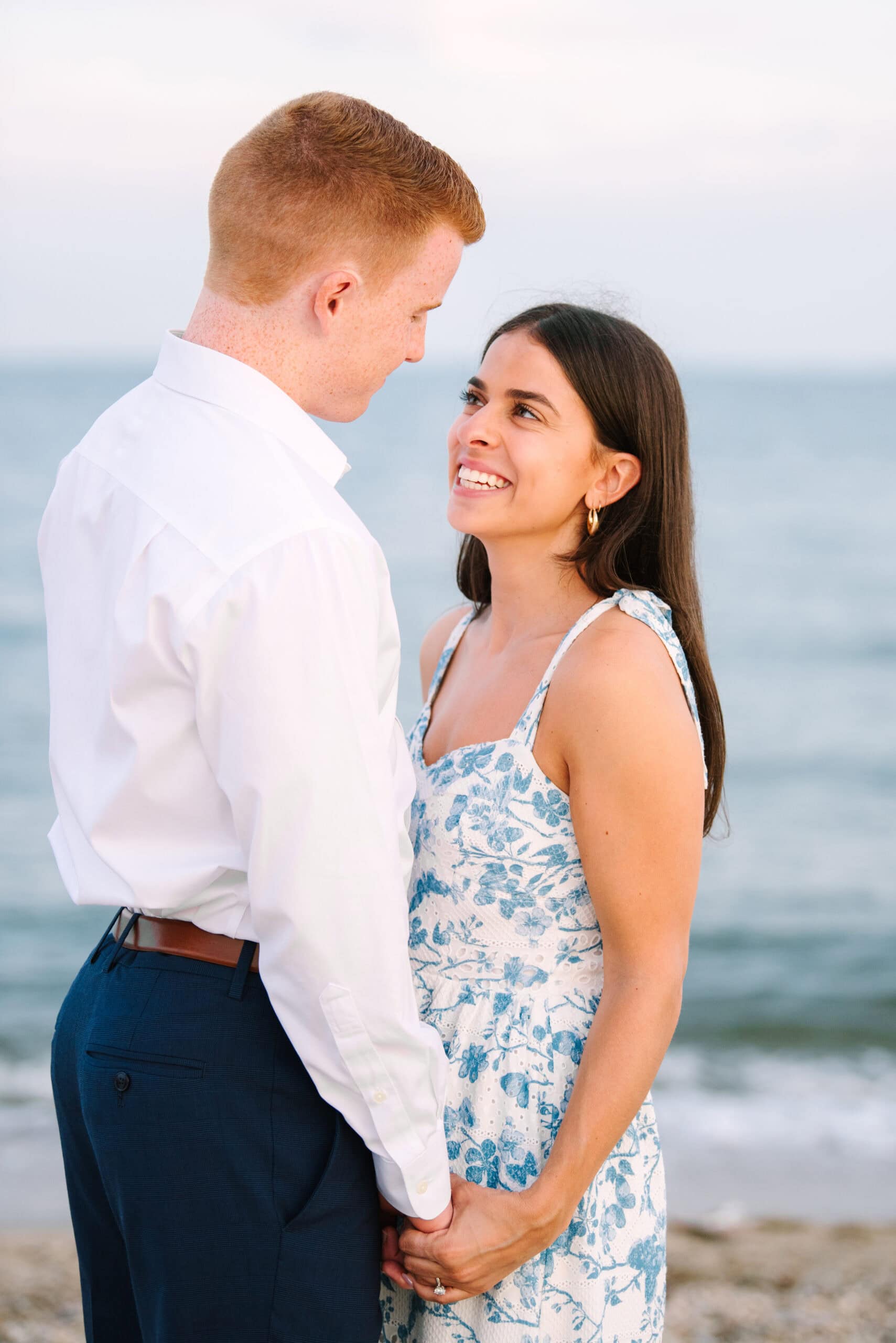 close up of woman smiling at fiance during a cape cod surprise proposal session on menahaunt beach 