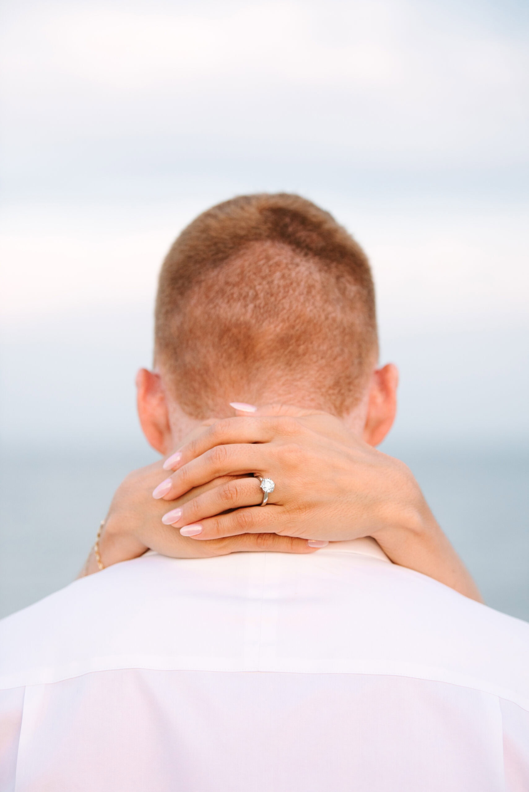 close up of engagement ring during a cape cod surprise proposal session on menahaunt beach 