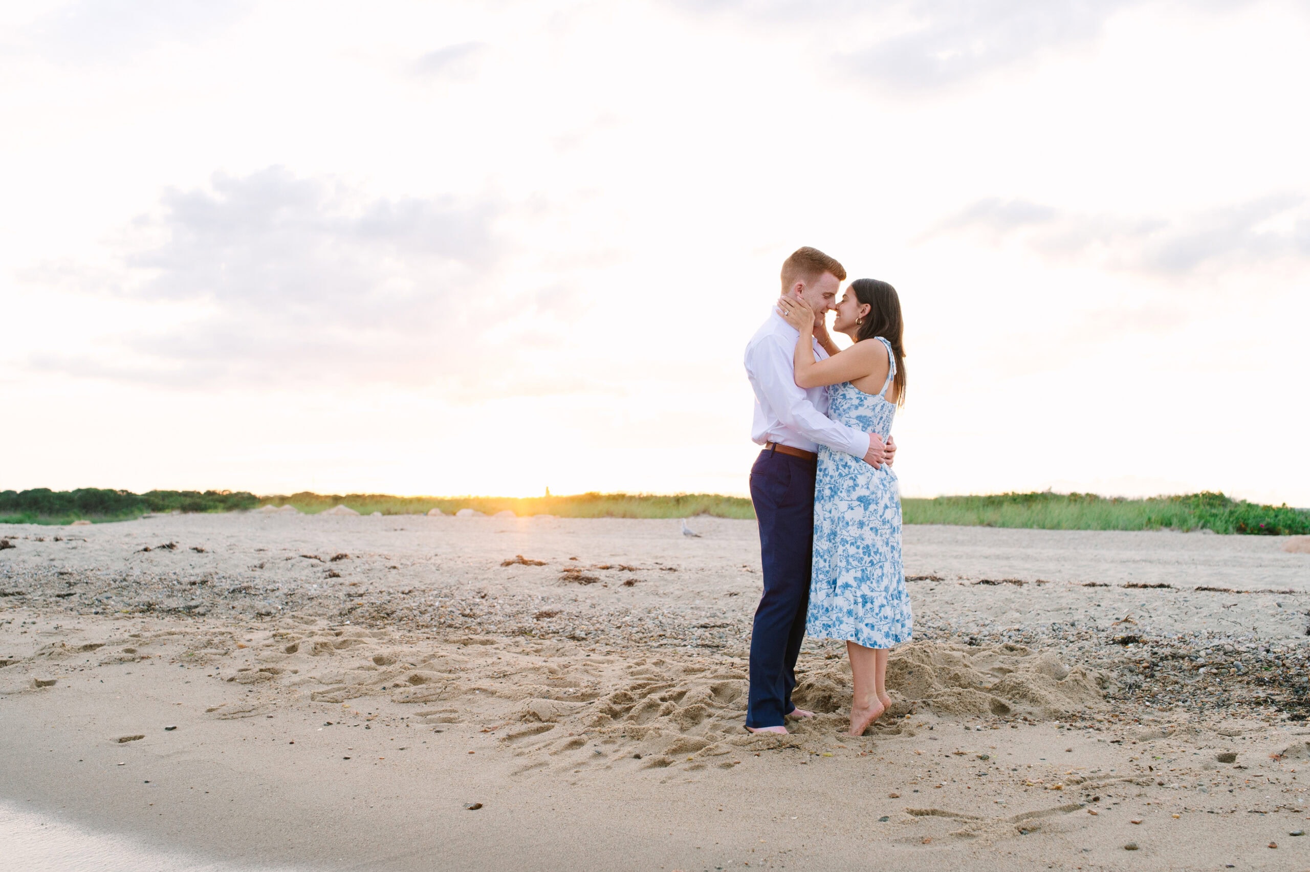 just engaged couple about to kiss on menahaunt beach during their cape cod surprise proposal session