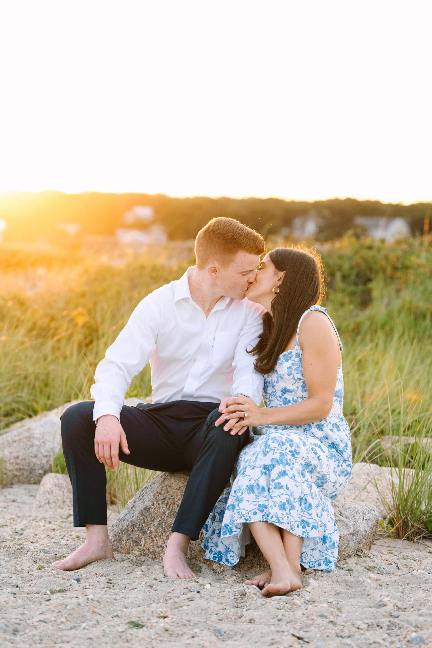 just engaged couple kissing on menahaunt beach during their falmouth cape cod proposal session