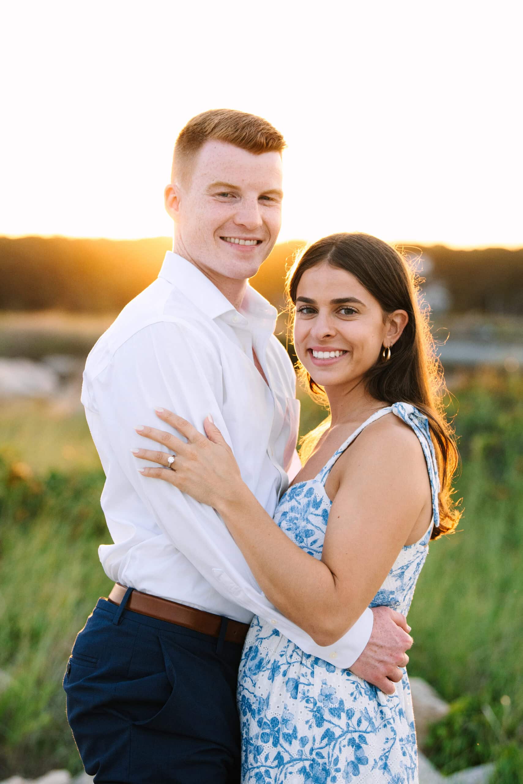 newly engaged couple smiling during their falmouth cape cod proposal session captured by Meghan Lynch