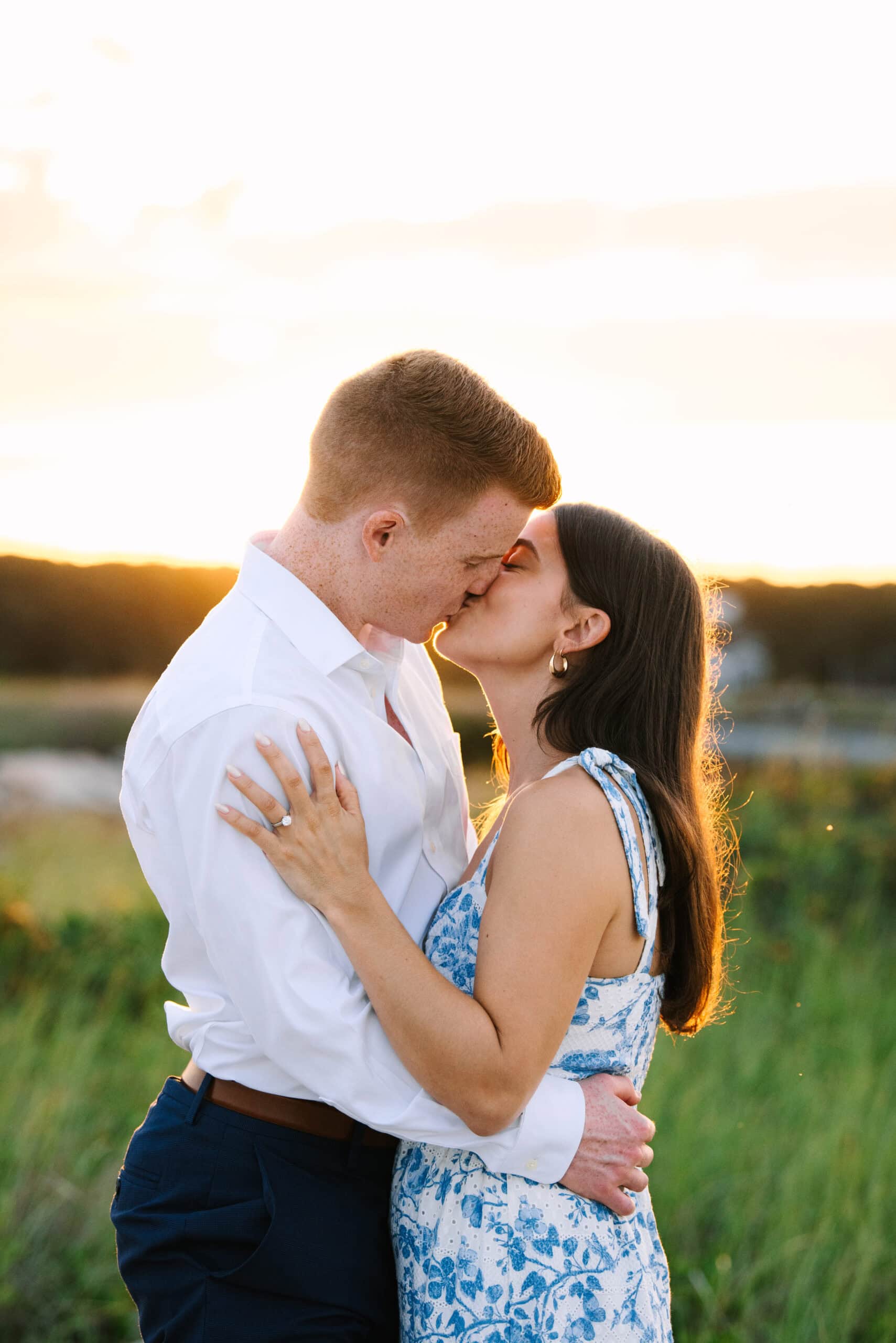 just engaged couple kissing on menahaunt beach during their falmouth cape cod proposal session