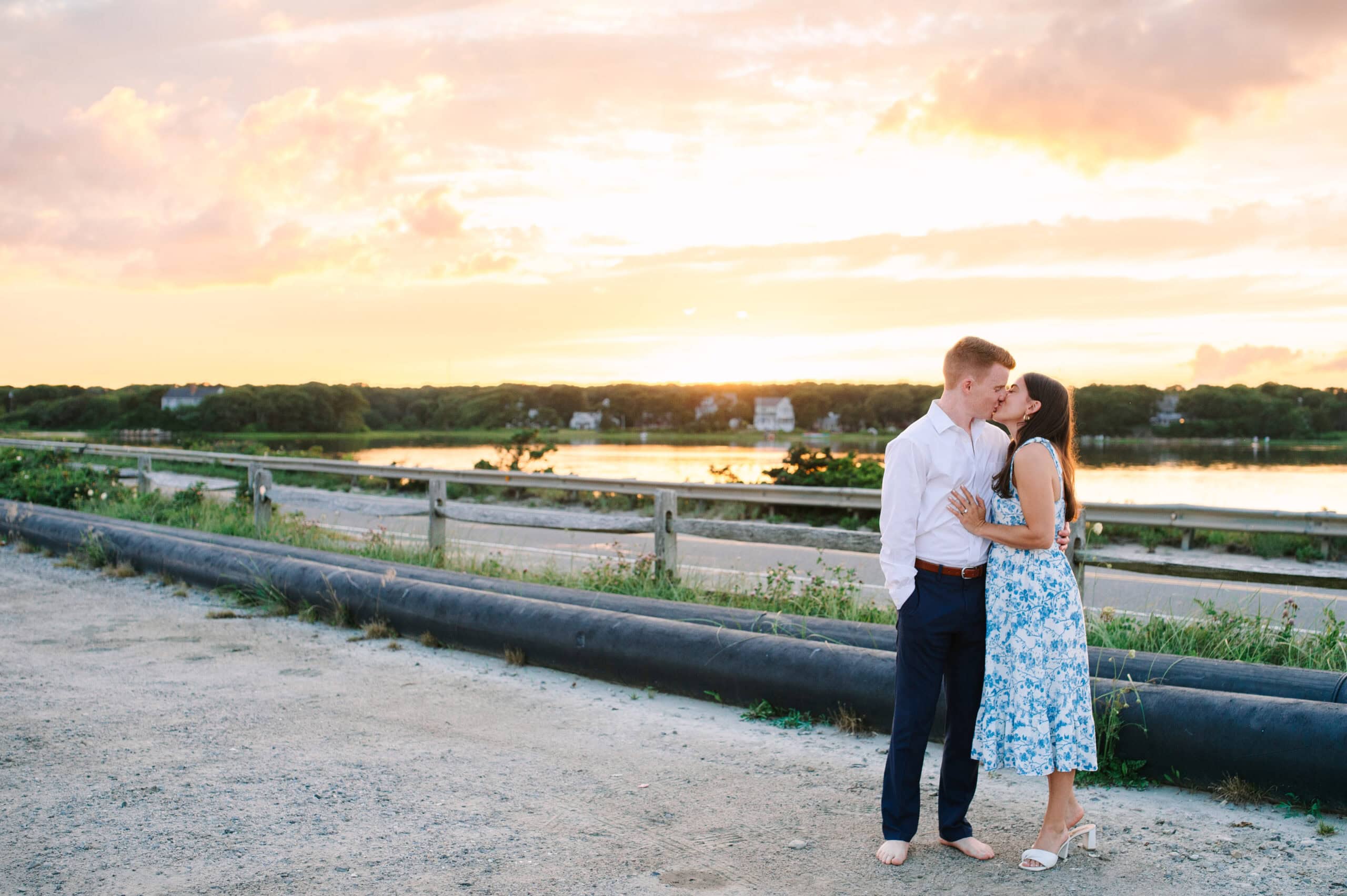 just engaged couple kissing on menahaunt beach during their falmouth cape cod proposal session