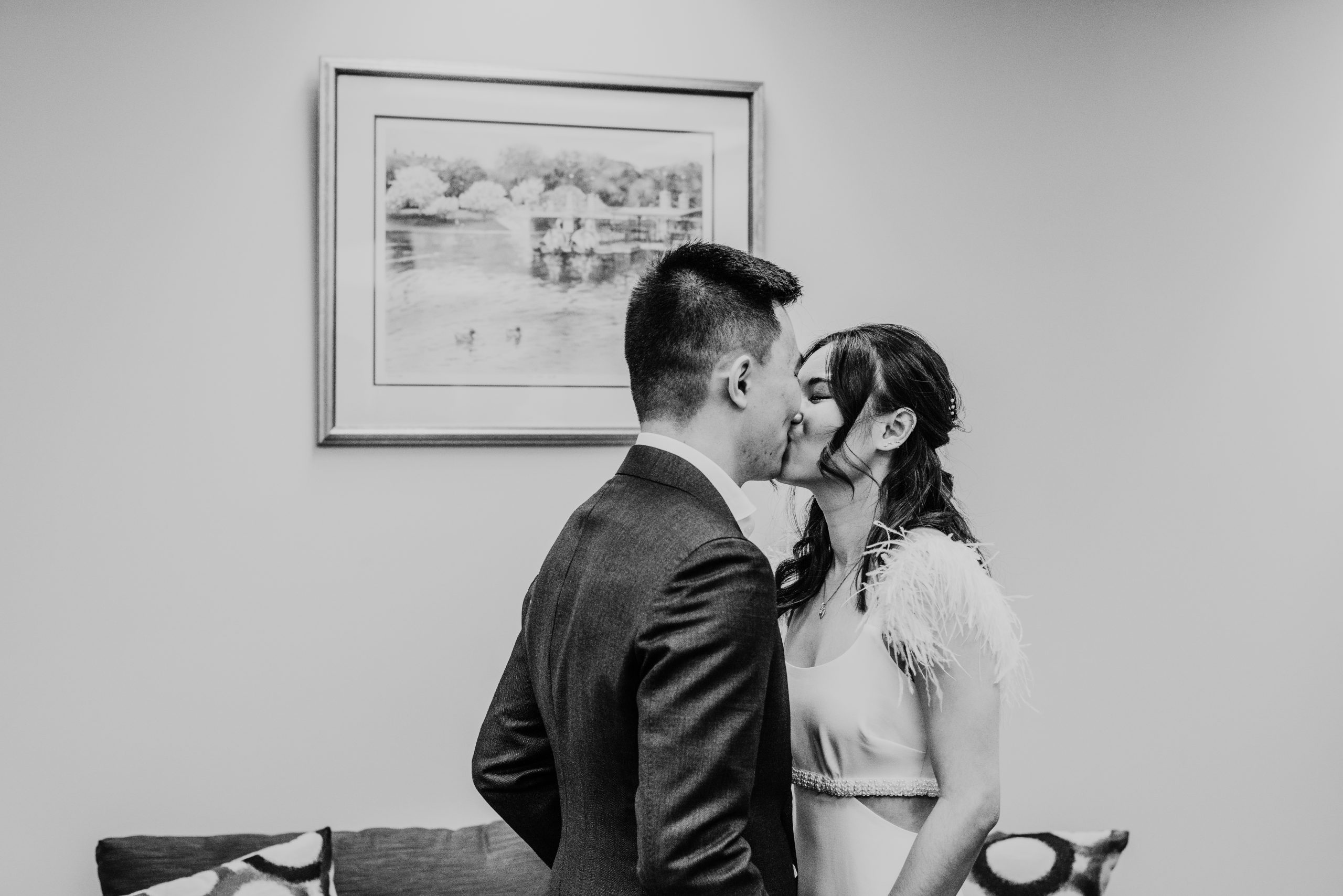 black and white photo of bride and groom kissing during their city hall wedding captured by Boston elopement photographer meghan lynch
