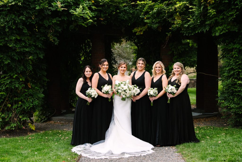 bride and bridesmaids portrait at turner hill mansion captured by massachusetts wedding photographer Meghan Lynch