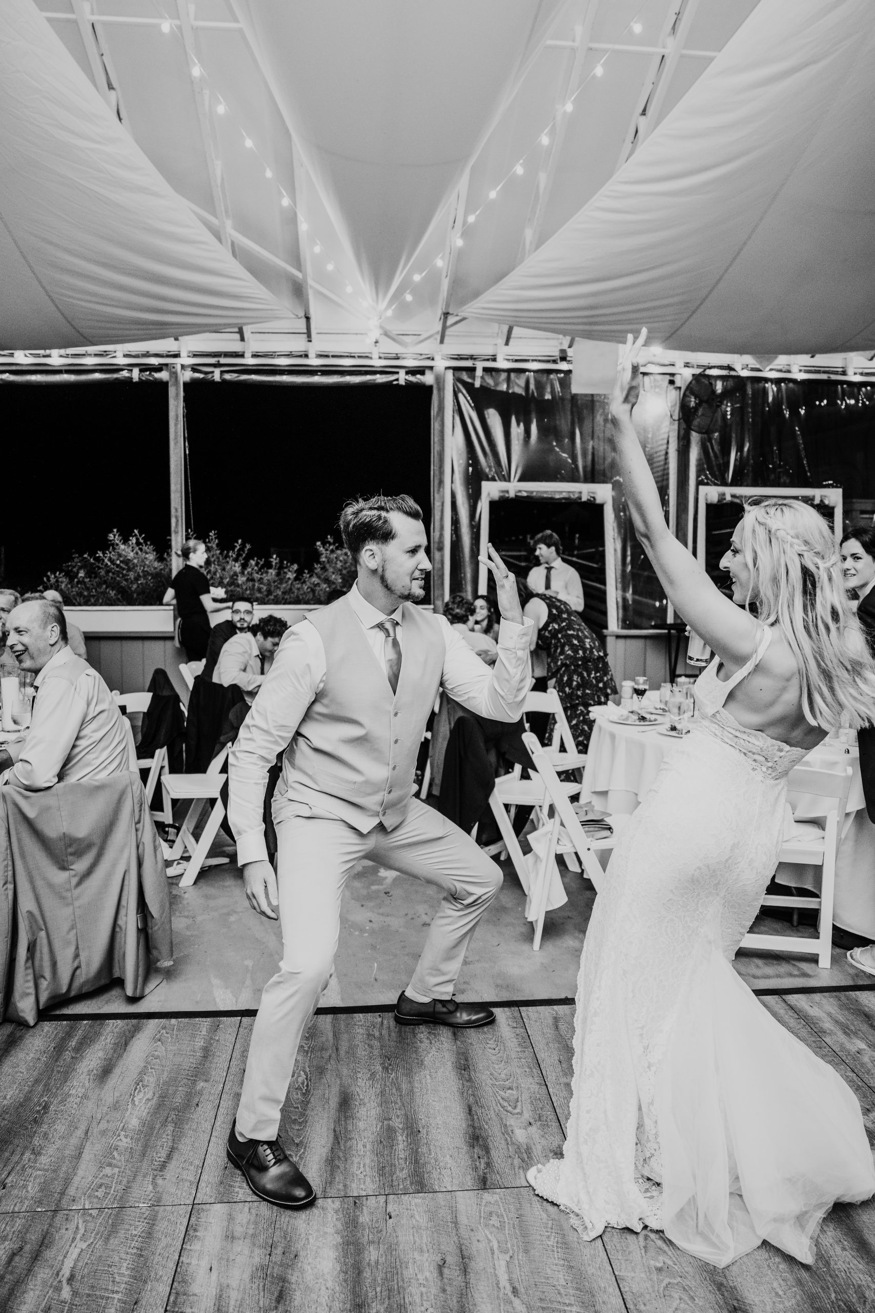 black and white photo of a bride and groom dancing during their Popponesset Inn wedding reception on cape cod 