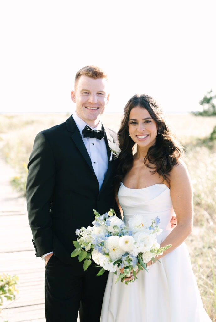 bride and groom closeup portrait on the dunes of the Wychmere Beach Club during their Cape Cod wedding