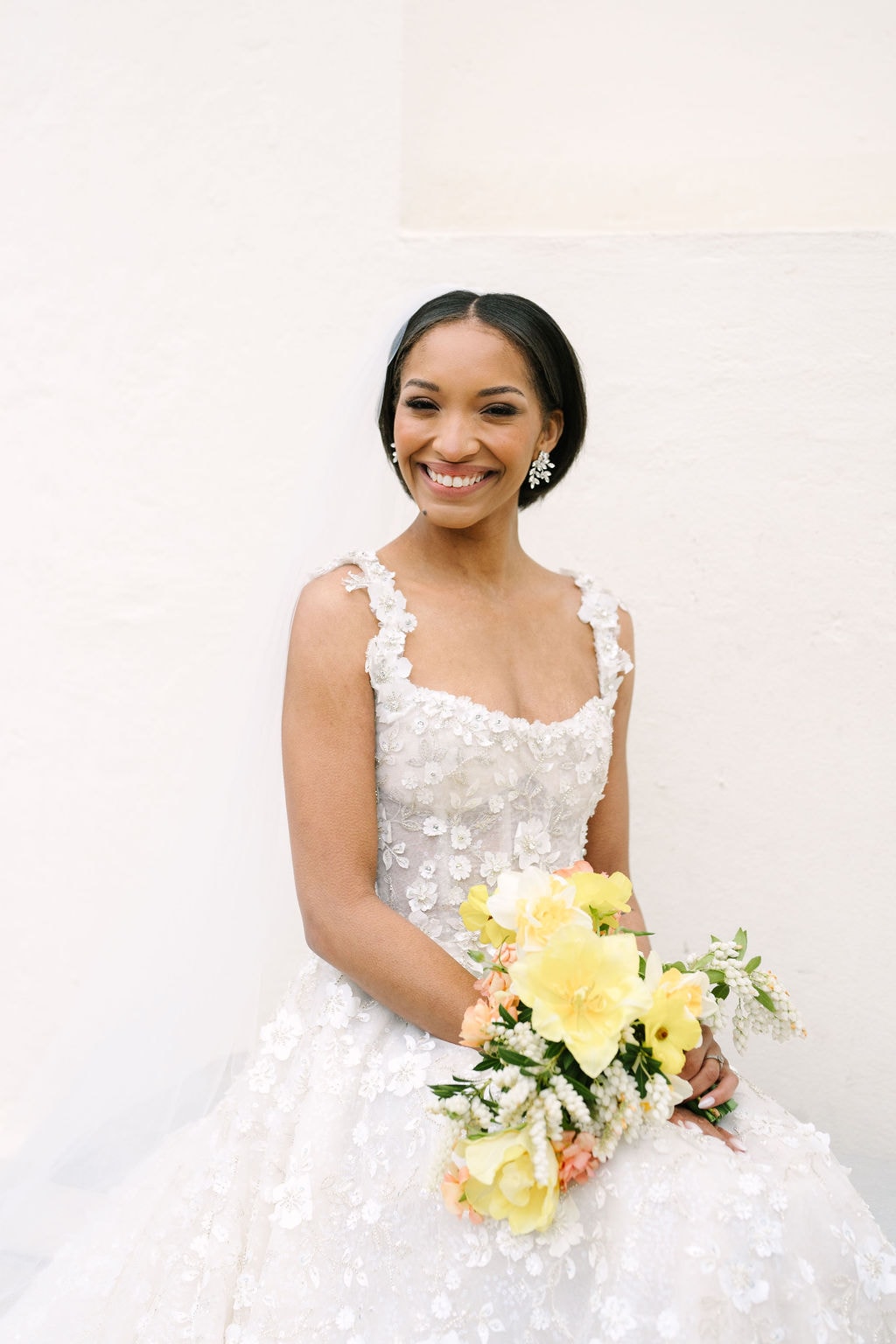 portrait of a bride sitting with her bouquet in her lap at a wadsworth mansion wedding