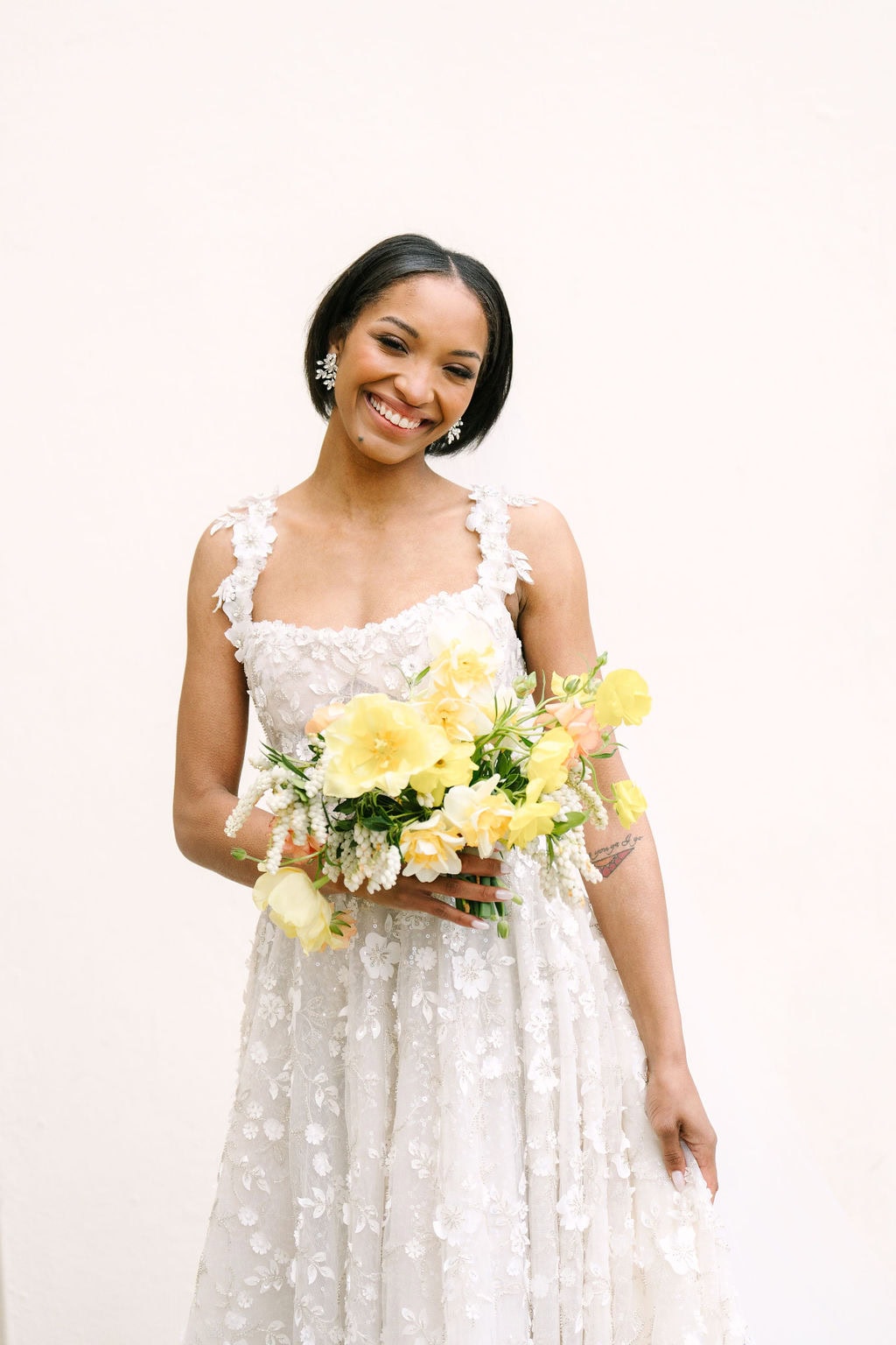 portrait of bride holding her bouquet and dress at a connecticut wedding