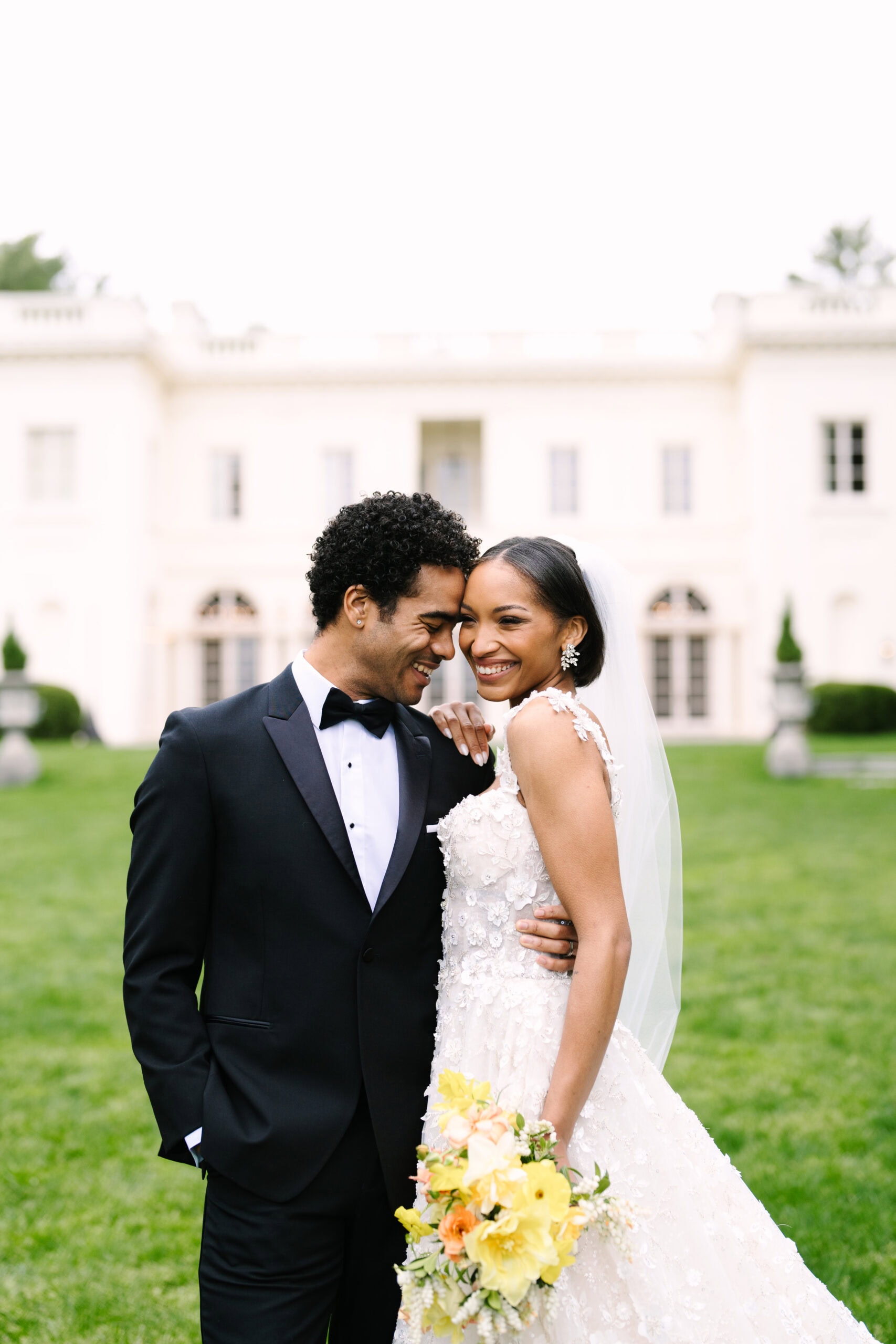 close up of bride and groom laughing leaning into each other at their wadsworth mansion wedding