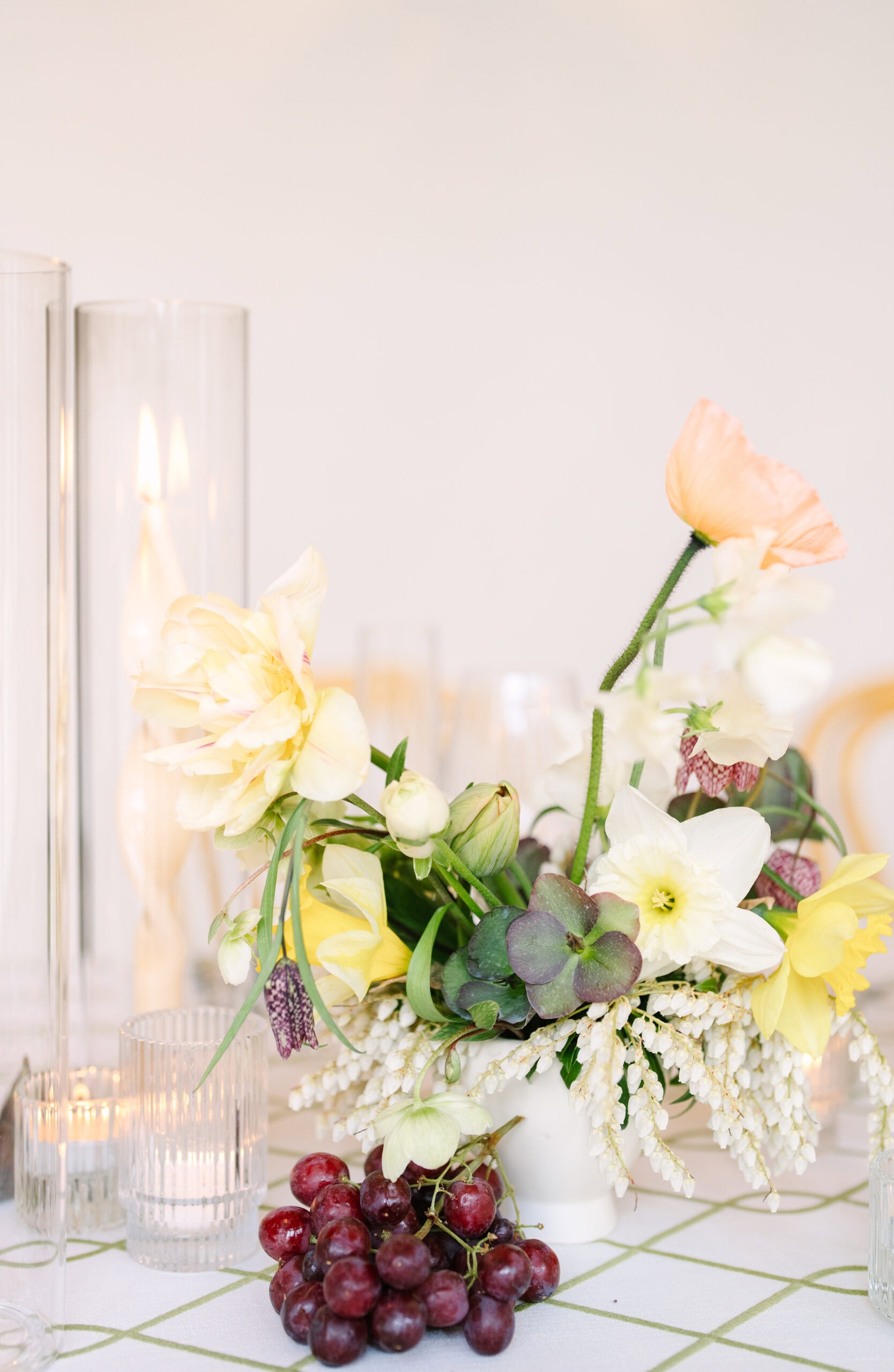 close up of flowers and candles on a reception table at the wadsworth mansion in ct