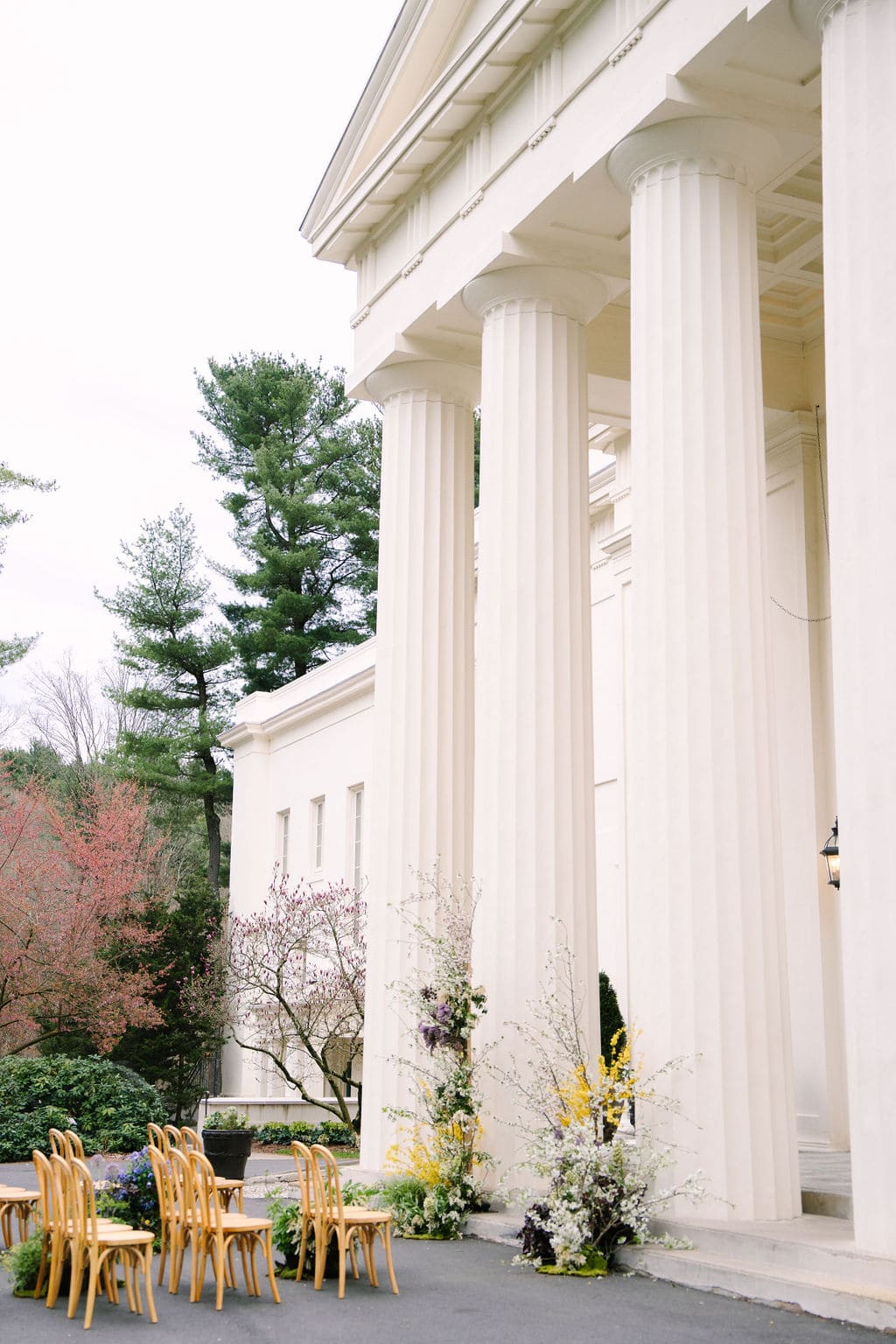 side view of the wedding ceremony site without guests in front of the wadsworth mansion pillars