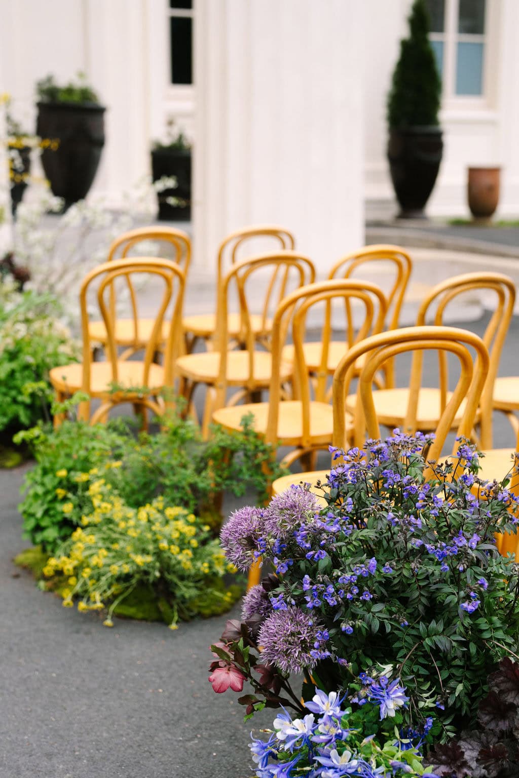 close up on the ceremony flowers and chairs at a wadsworth mansion wedding