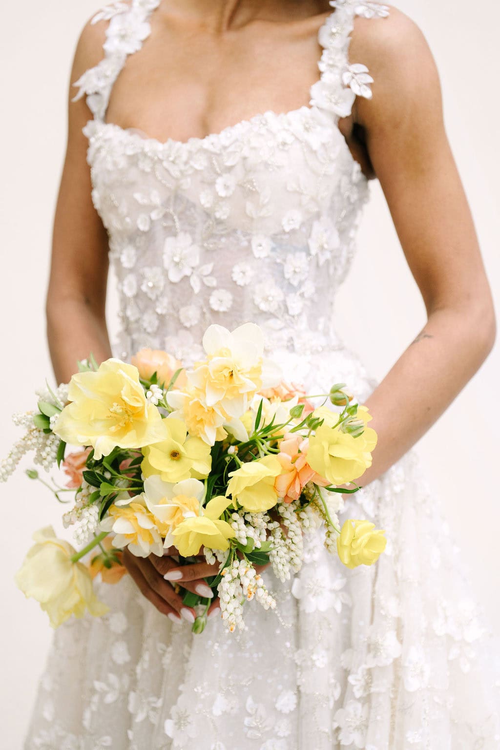 close up of the bride's bouquet against her dress at a wadsworth mansion wedding