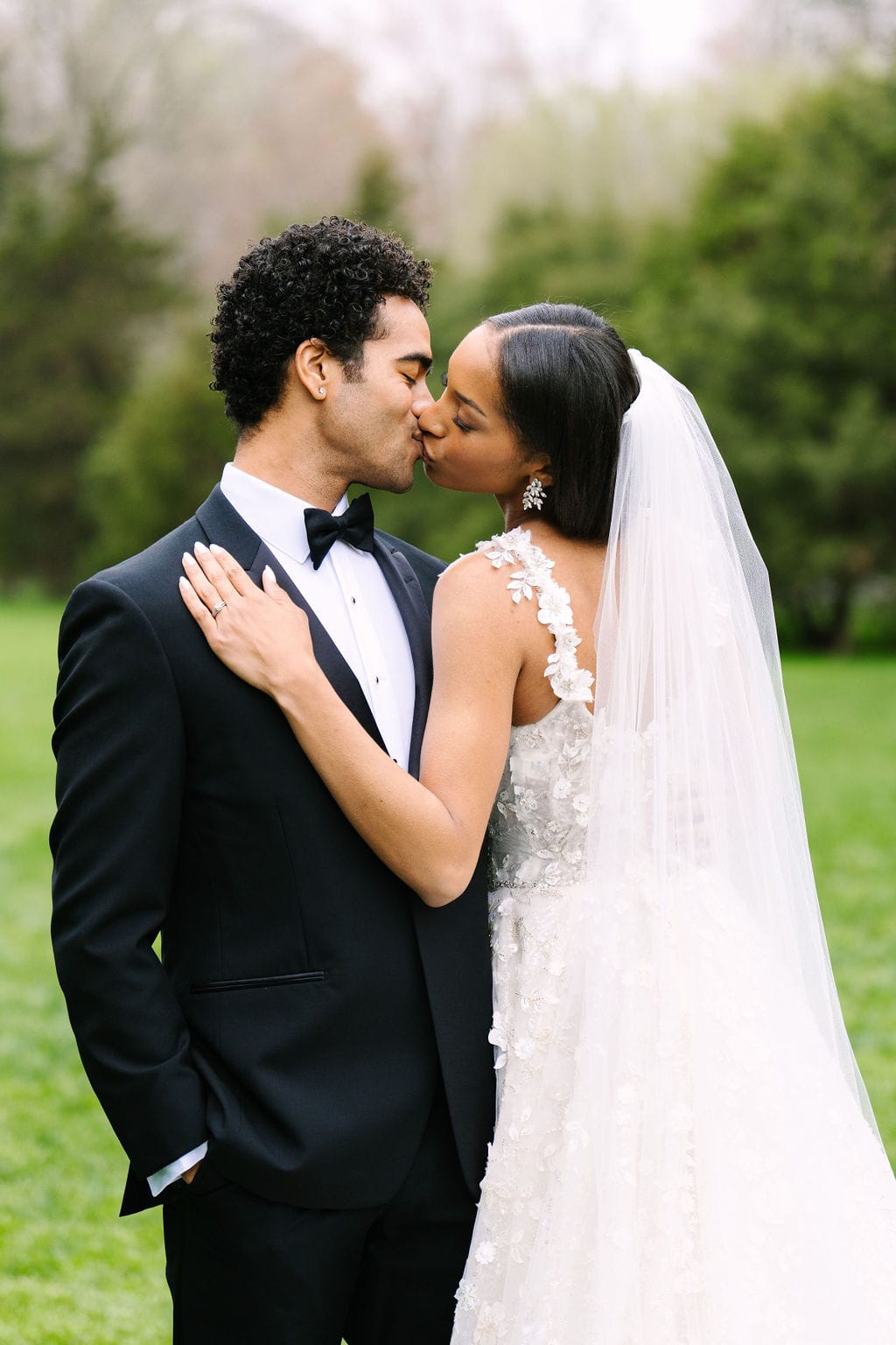 close up of bride and groom kissing during their black tie wedding at the wadsworth mansion in connecticut