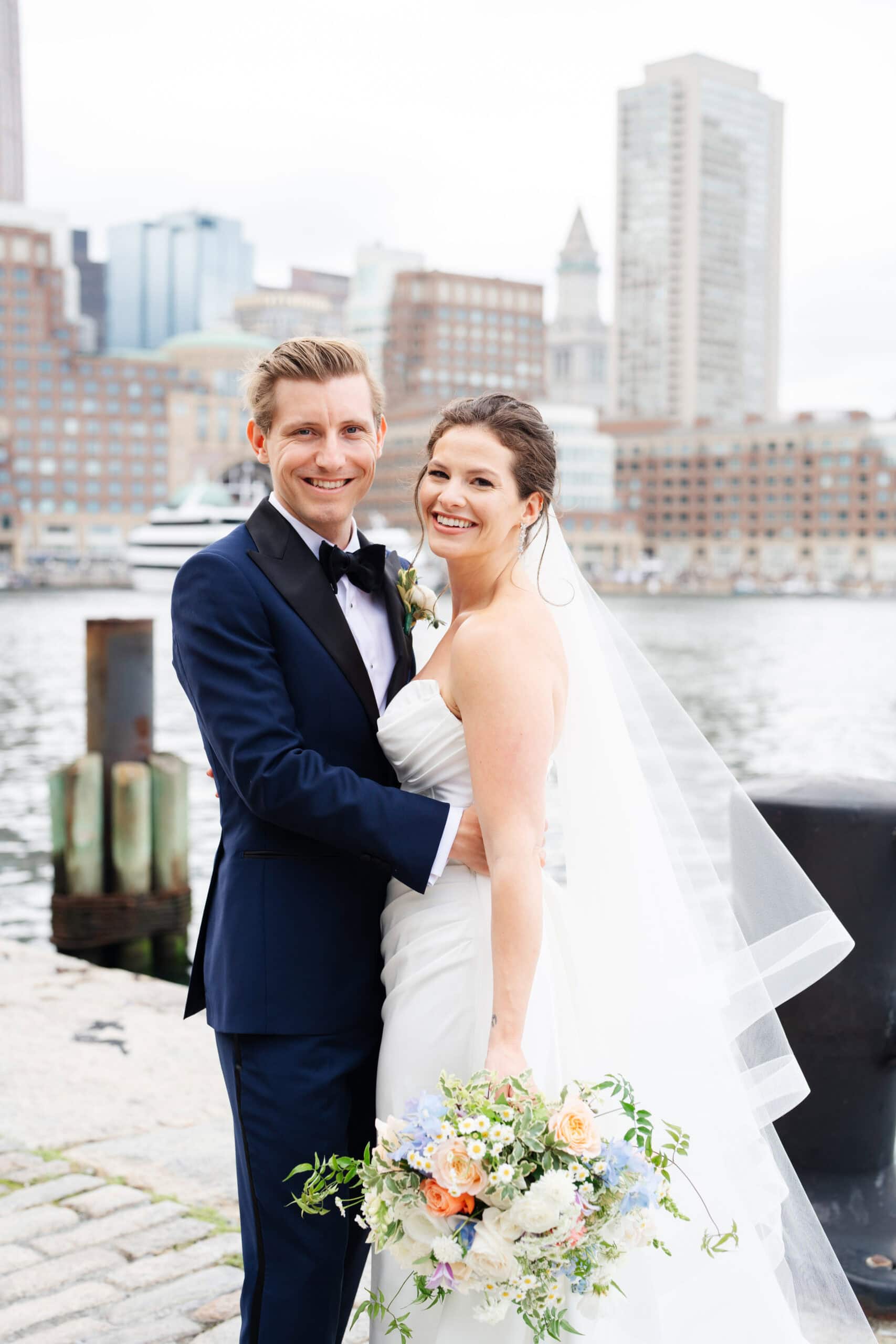 Bride and groom smiling at the camera during their ica boston wedding captured by Meghan Lynch