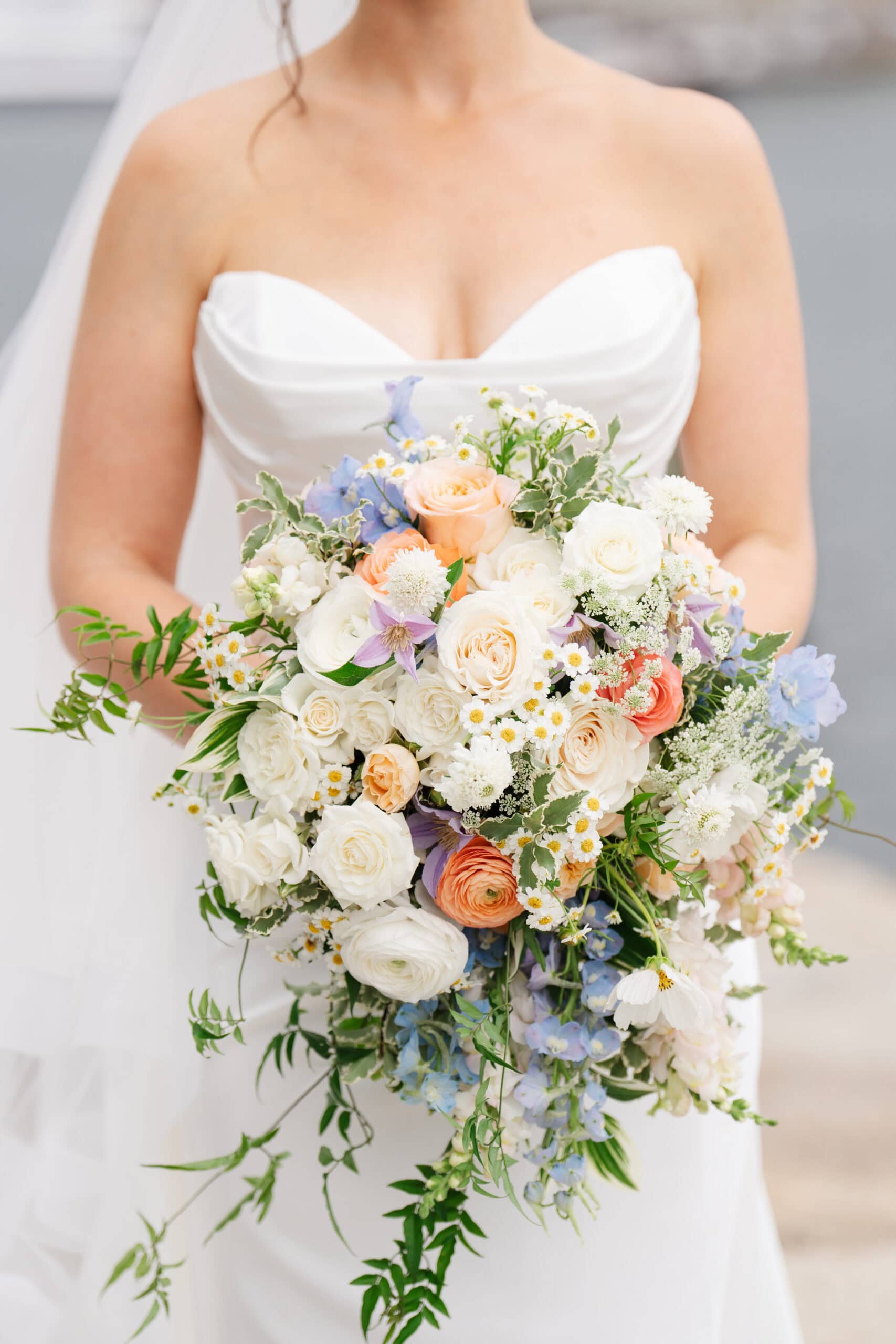 closeup of bride's hands holding her wedding bouquet during her boston wedding at the institute of contemporary art